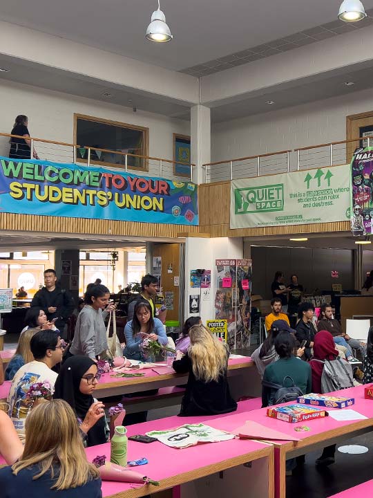 A photograph of students at an event in the Hive