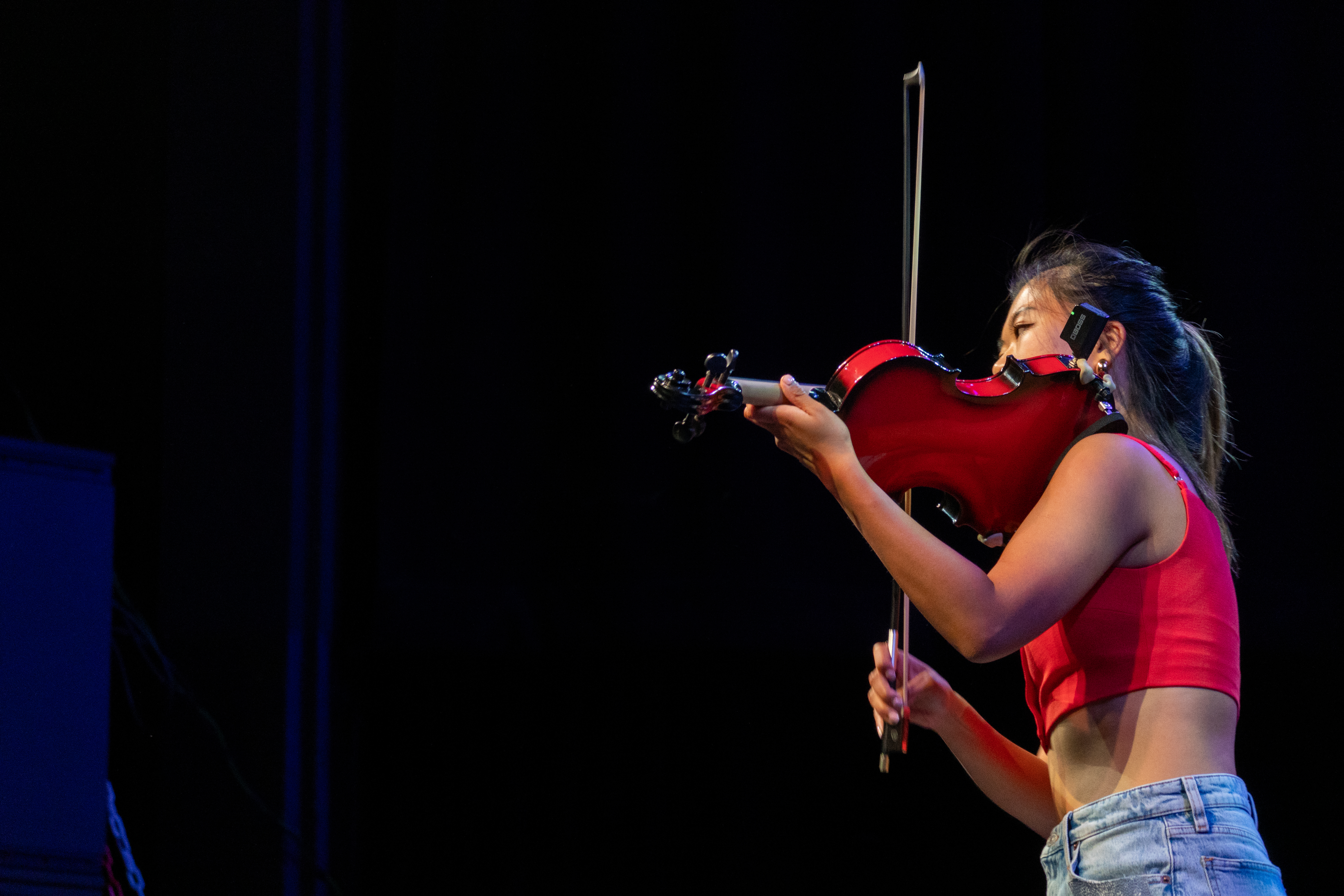 A photograph of students dancing on stage