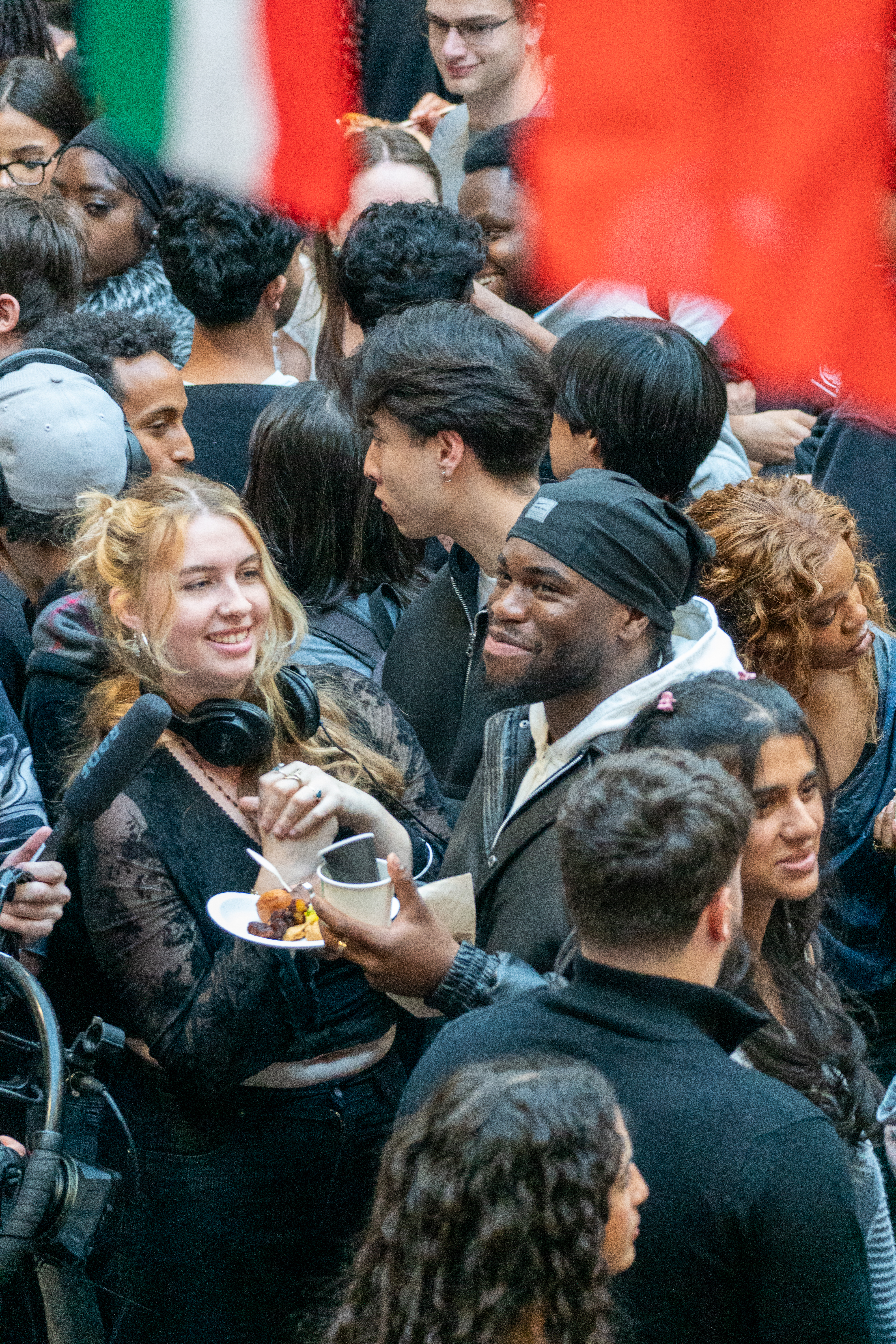 A photograph of students dancing on stage