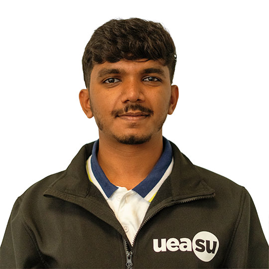 Bhaskar against a white background, wearing a black ‘ueasu’ jacket